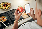 Health, website and phone with man cooking food while reading online with blog, internet or app. Kitchen, network and breakfast with chef with tomato and search recipe for diet, nutrition or lunch