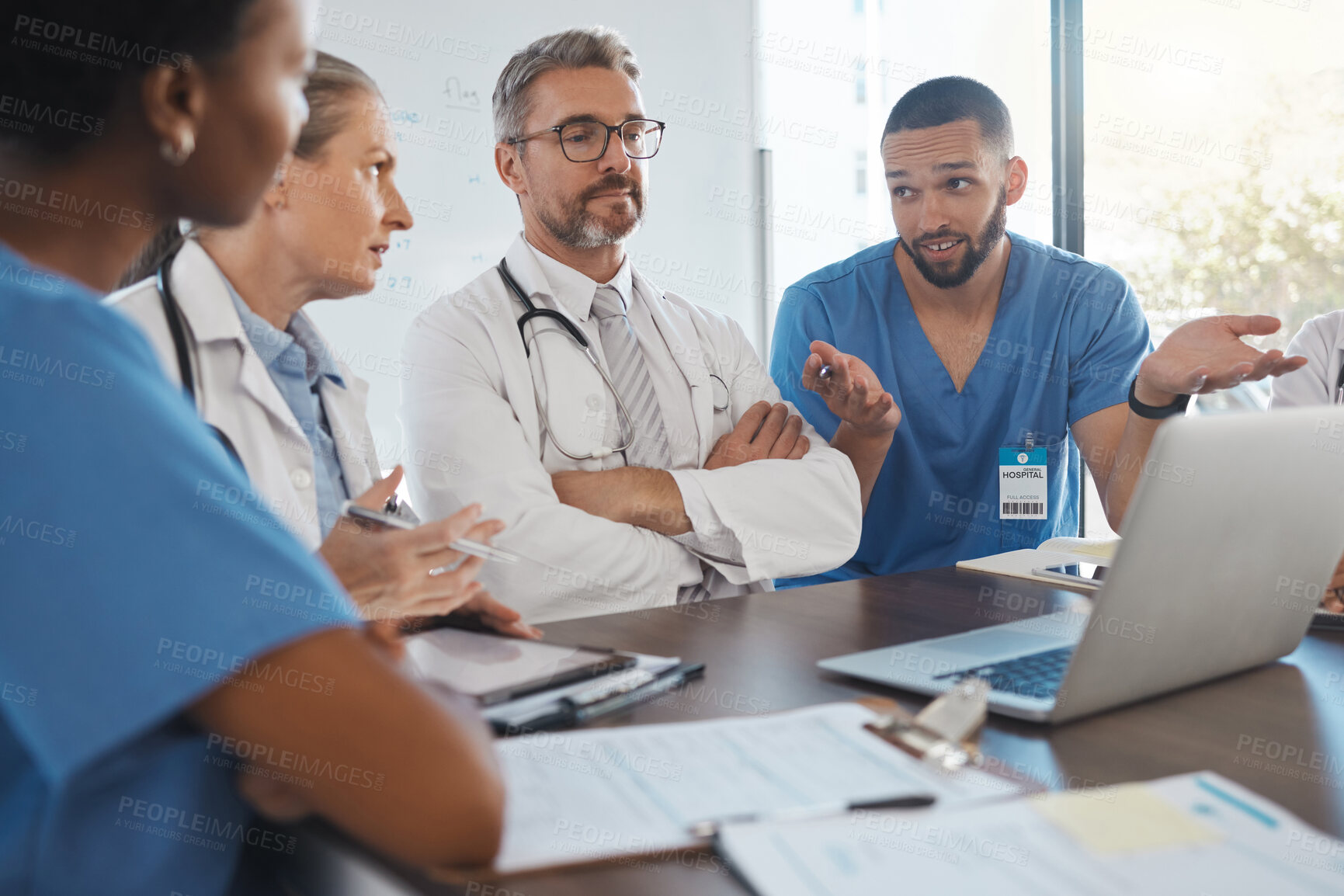 Buy stock photo Leadership, doctor and teamwork planning on laptop in conversation, discussion and meeting for healthcare staff management. Hospital consulting medical manager or leader in collaboration on results