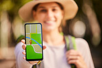 Woman, hand and phone screen, gps or directions on holiday, vacation or trip. Tourist, travel and female from Canada on mobile, traveling or map apps, lost or looking for help with internet maps