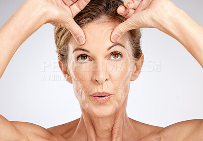 Buy stock photo Senior woman, beauty portrait and face lift on gray studio background. Wellness, skincare model and lady from Canada with spa aesthetic for skin anti aging, cosmetics or healthy facial care treatment