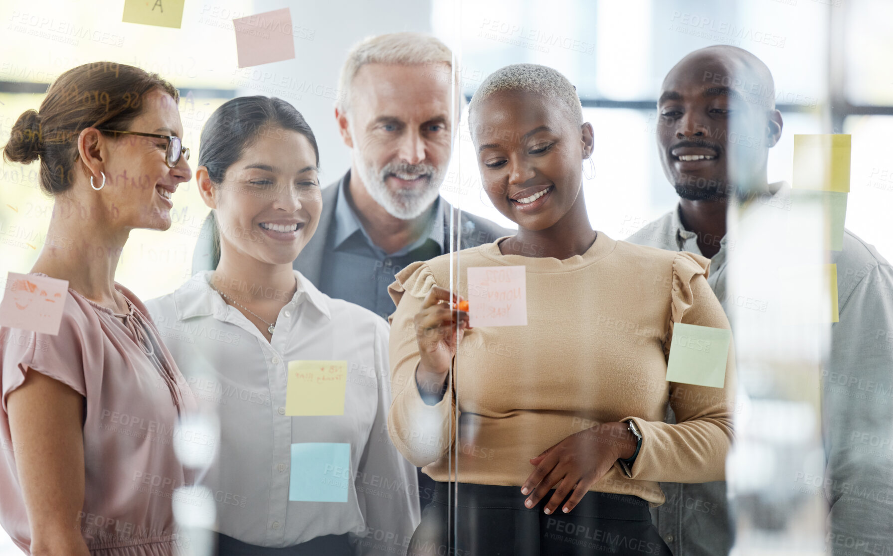 Buy stock photo Business people, team and sticky notes for planning, strategy or brainstorming meeting together at the office. Diverse group of creative workers in collaboration for ideas, pages or schedule tasks