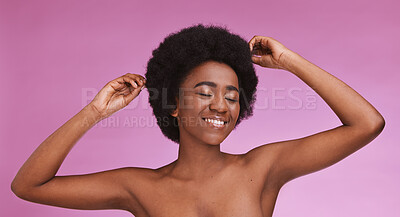 Buy stock photo Black woman, touching afro hairstyle on beauty studio background in relax skincare, texture maintenance or salon wellness. Model, natural and hair growth hands on isolated pink or makeup backdrop