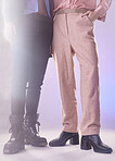 Fashion, vintage and closeup of pants in a studio for a retro, trendy and stylish outfit. Style, glitter and gay men with edgy, style and elegant clothes and boots by a purple gradient background.