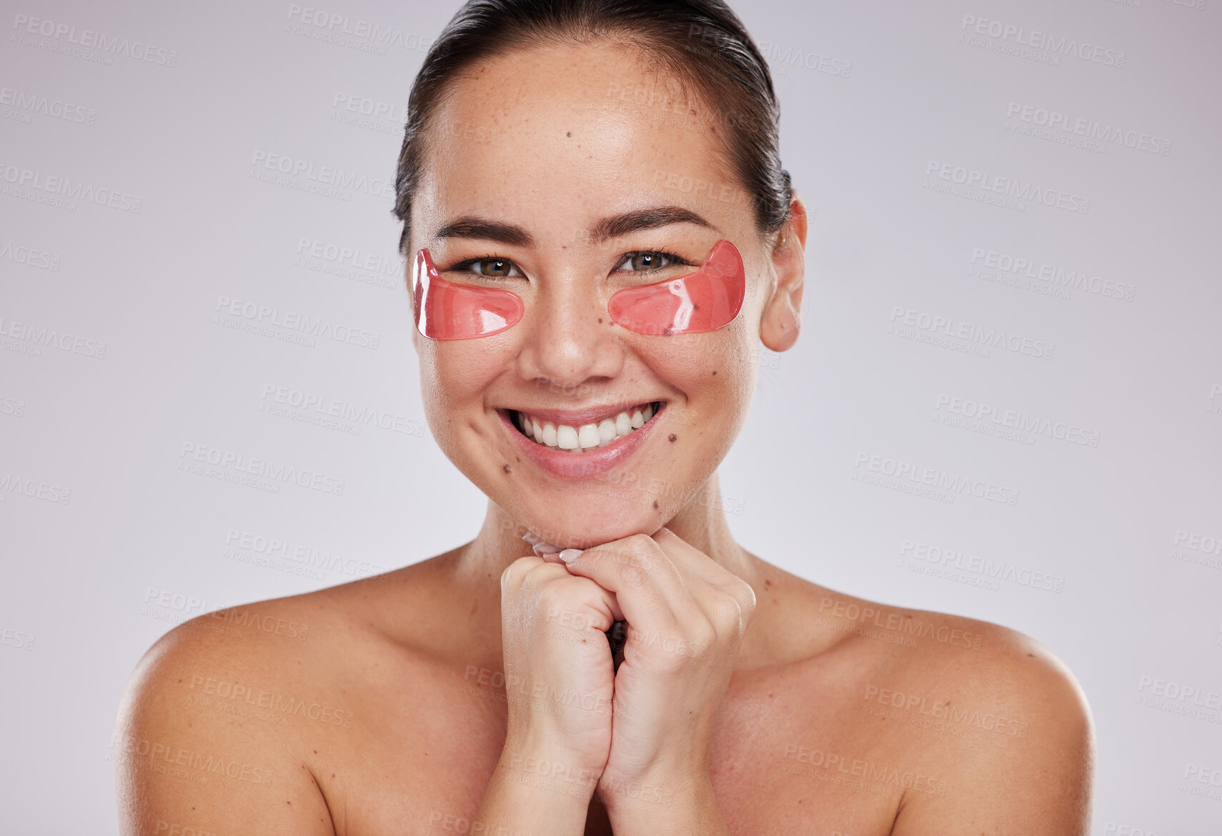 Buy stock photo Skincare, portrait and asian woman with eye pad on face for anti aging facial on studio background. Beauty, cosmetics and lady with collagen mask or patches on eyes for fresh skin, smile and wellness