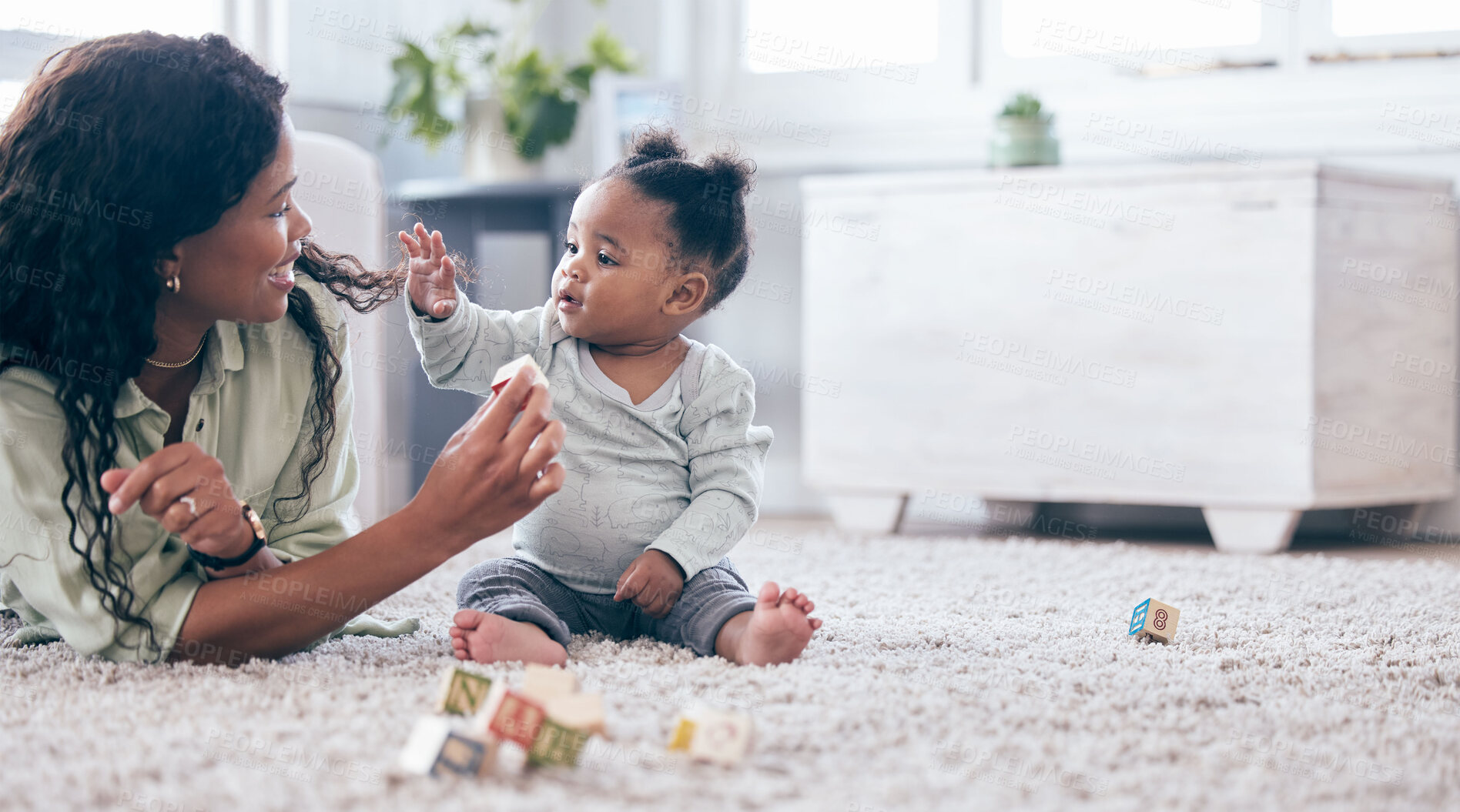 Buy stock photo Black baby, mother and toy letter blocks for language development on living room floor. Family home, teaching and mom with girl toddler learning with happiness and a smile with love and mockup