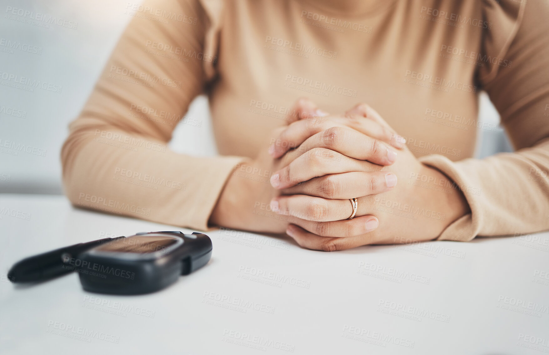 Buy stock photo Hands, anxiety and diabetes with a woman waiting for the results of a test while sitting at a table. Healthcare, blood and equipment with a female diabetic testing her sugar or glucose level