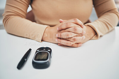 Buy stock photo Hands, diabetes and glucose machine on table for woman with medical problem, self care or wellness. Monitor, glucometer or blood test of sugar level, healthcare or insulin for patient at desk in home