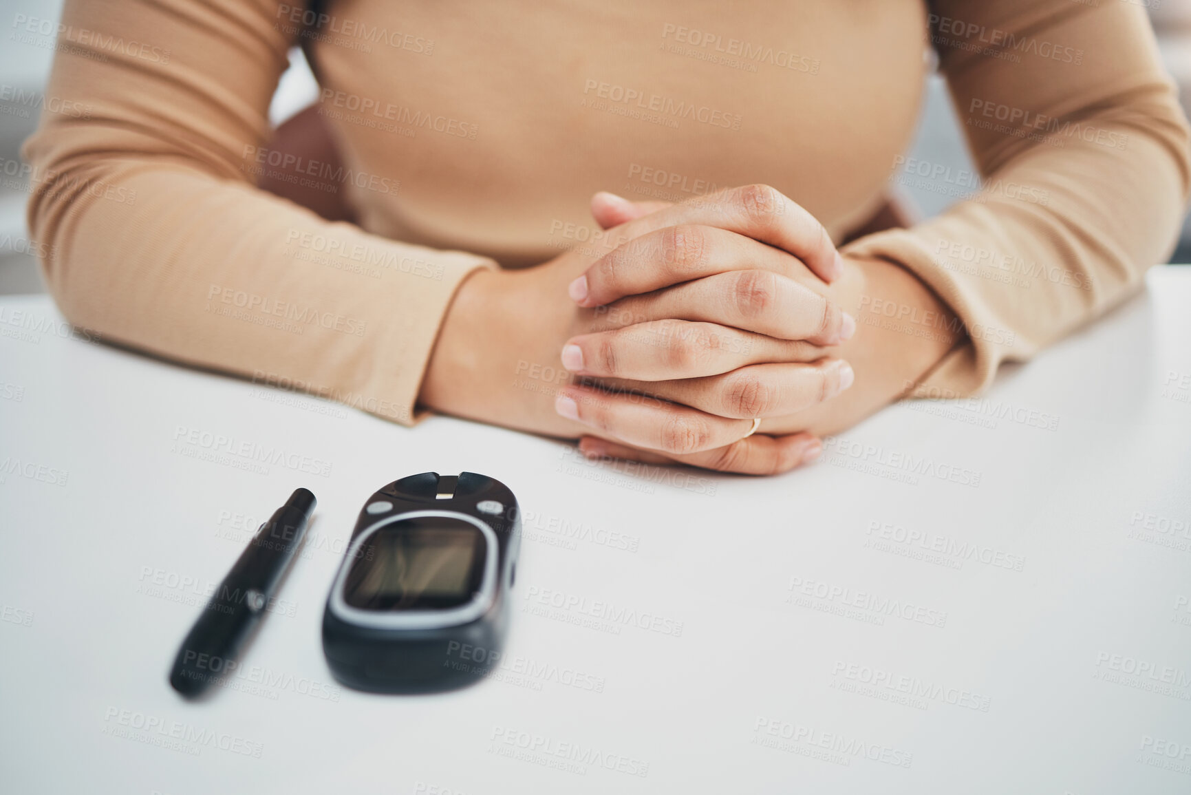 Buy stock photo Hands, diabetes and glucose machine on table for woman with medical problem, self care or wellness. Monitor, glucometer or blood test of sugar level, healthcare or insulin for patient at desk in home