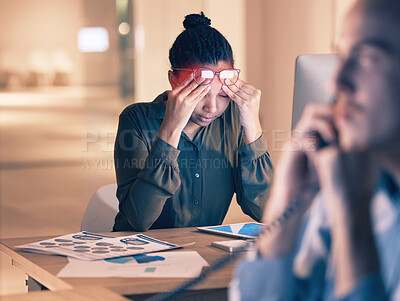 Buy stock photo Business woman, headache and computer in stress, burnout or suffering pain at night by office desk. Female employee rubbing head or touching painful area by desktop PC feeling overworked at workplace