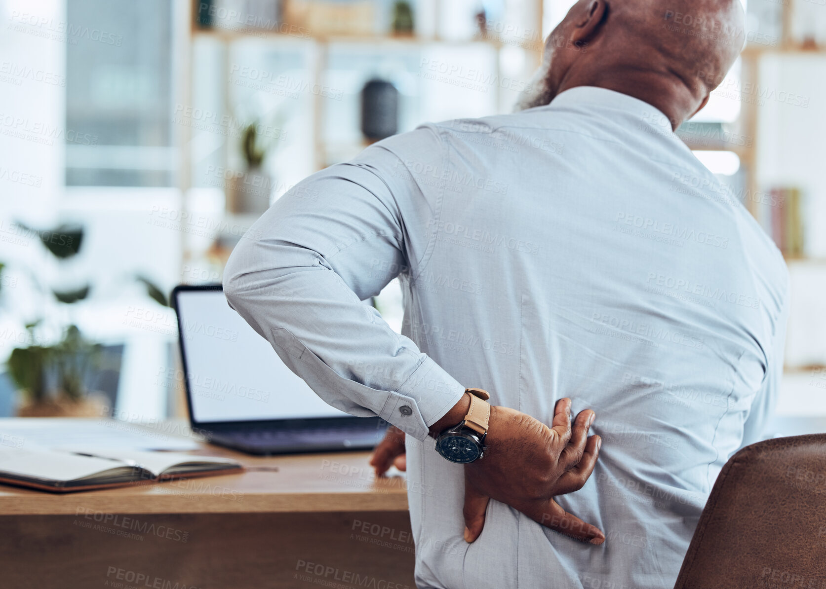 Buy stock photo Back, pain and business stress of black man with muscle injury, health risk and fatigue in chair. Uncomfortable employee with spine problem, bad posture and injured body from anxiety, burnout or sick