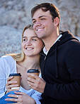 Morning coffee, couple and beach adventure of young people by the sea with happiness. Bonding, love and care of a man and woman together feeling happy on summer holiday outdoor with a smile