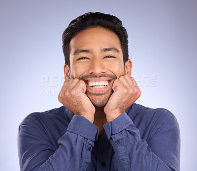 Buy stock photo Portrait, excited and Asian man with success, smile and guy with news against grey studio background. Happy, Japan and male touching face, celebration and cheerful with joy, announcement or life goal