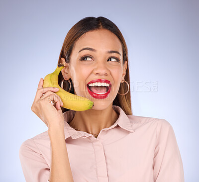 Buy stock photo Woman, studio and banana phone call for hello, happiness or comic communication for makeup, beauty or fashion. Gen z girl, funny chat or conversation with mobile fruit for diet, wellness or cosmetics