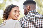Portrait, love and a couple in the park together for a romantic date for their anniversary celebration during summer. Face, spring and romance with an attractive young female dating her boyfriend