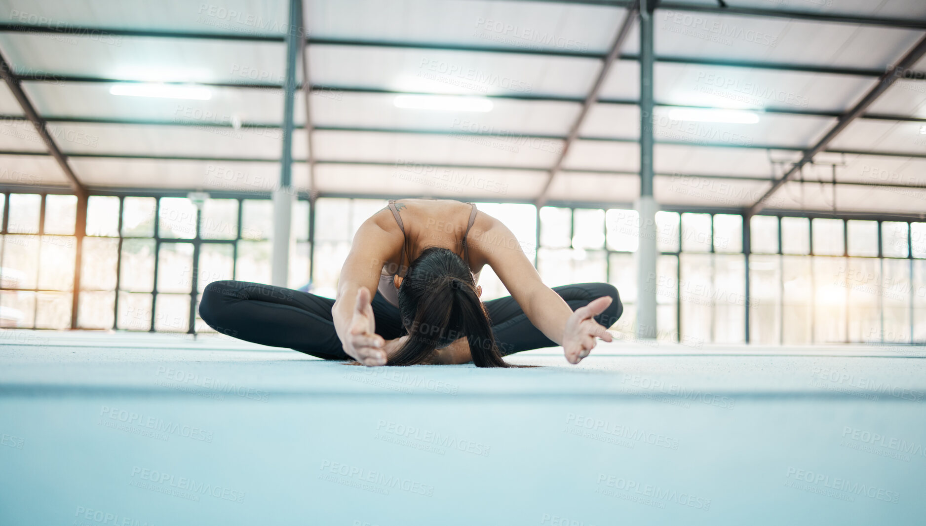 Buy stock photo Gymnastics, stretching and sport woman in a gym for exercise and flexibility training. Lotus pose, wellness and pilates of a female gymnast on a sports mat for workout and fitness in health studio