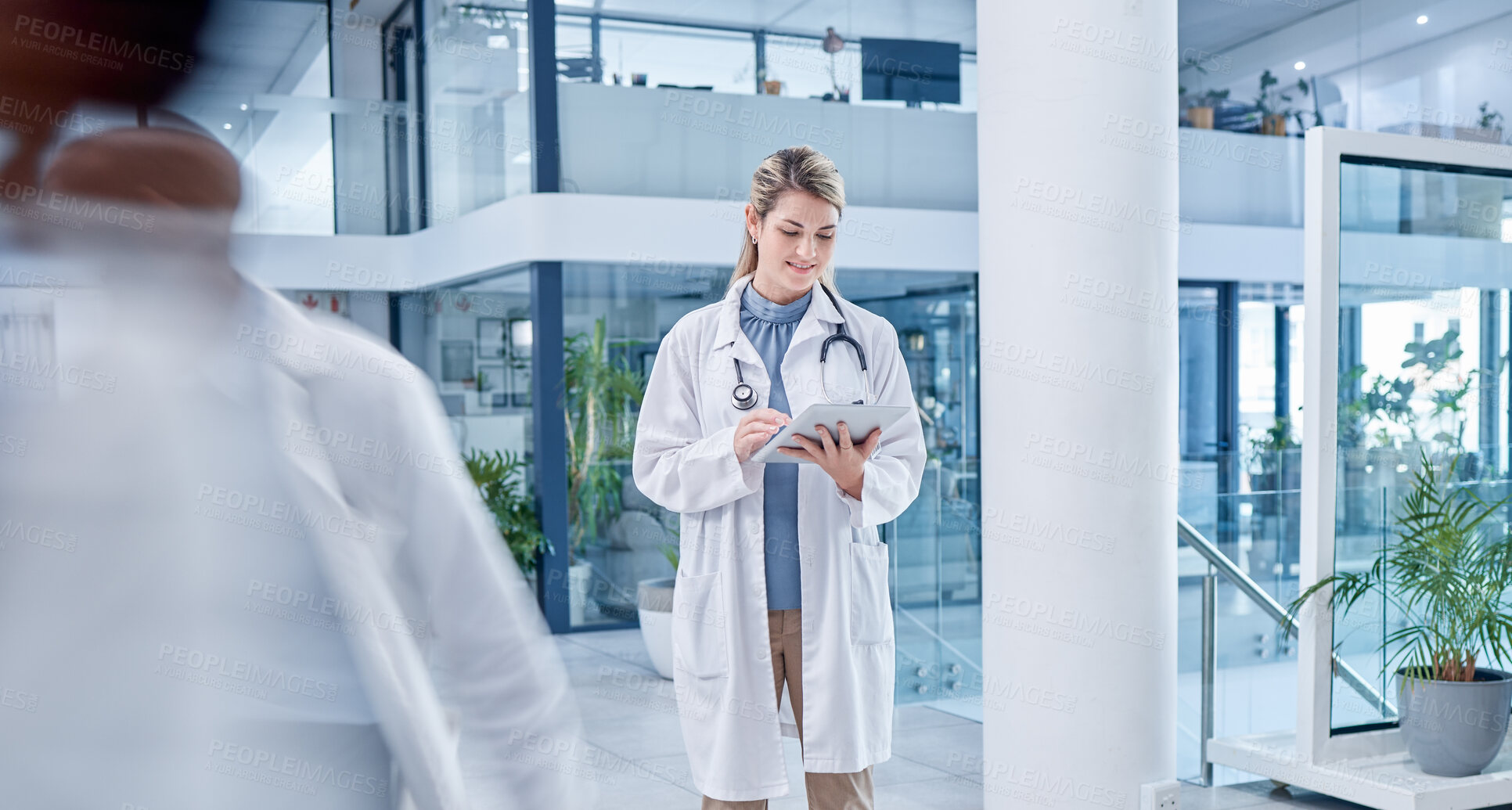 Buy stock photo Busy, woman and doctor with tablet, lobby and connection for research, online reading and healthcare. Medical professional, female employee and lady with device, telehealth and touchscreen in clinic