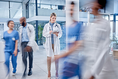 Buy stock photo Busy, woman and doctor with tablet, typing and hospital for help, online reading and consultation. Medical professional, female and lady with device, lobby and connection to search website and medic