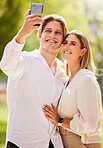 Couple, selfie and happiness outdoor for love, care and smile together in garden, nature and freedom. Happy man, young woman and take photograph in park for holiday, date and relax in summer sunshine