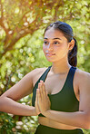 Yoga, praying hands and woman in nature for wellness, balance and peace on bokeh background. Pose, meditation and girl in countryside for mental health, zen and cardio, pilates and chakra workout