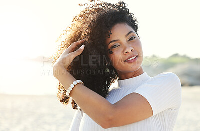 Buy stock photo Black woman, beauty and portrait at beach for vacation, freedom and face with natural hair and smile. Happy young female person outdoor in nature for peace, travel and time to relax on sunset holiday