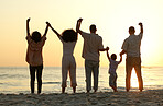 Sunset, holding hands and excited with big family at beach for happy, freedom and relax on vacation. Travel, holiday trip and summer break with parents and children for care, support and solidarity 