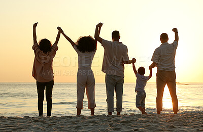 Buy stock photo Sunset, holding hands and cheering with family at beach for happy, freedom and relax on vacation. Travel, holiday trip and summer break with parents and children for care, support and solidarity 