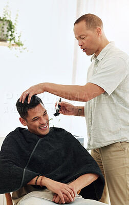 Buy stock photo Barbershop, barber and man hairstylist in salon cutting hair for client grooming service for happy customer. Male, hairdresser or person gets trim with clippers at appointment for beauty and wellness