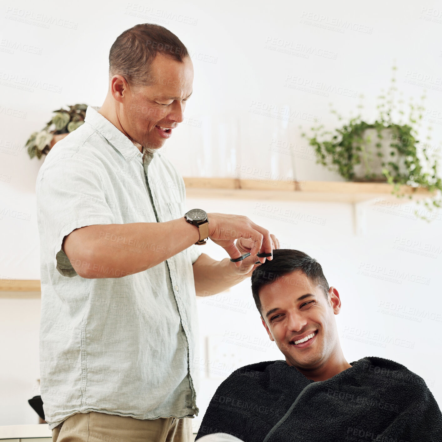 Buy stock photo Father, man and shaving hair in home for grooming, cleaning and trimming. Smile, laughing and happy male or son getting haircut with electric shaver from senior dad for hairstyle and bonding in house