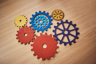 Buy stock photo Mechanism, brainstorming and connection with cog gear on table for teamwork, solidarity and development. Collaboration, strategy and solution with machine parts for structure, cooperation or progress