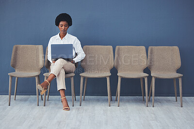 Buy stock photo Black woman, laptop and focus for interview on chair with email, waiting and ready for job opportunity. Young african businesswoman, recruitment and mockup with computer for typing, research and goal