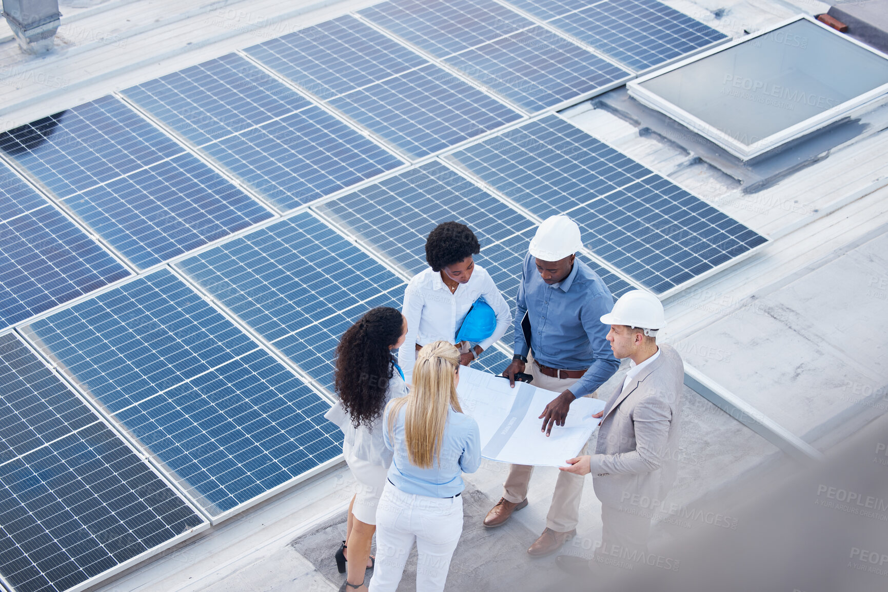 Buy stock photo Solar energy, teamwork or engineering designers with blueprint on roof building grid technology for innovation. Collaboration, top view or business people talking or planning a development project 