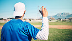 Sports athlete, baseball field or man with ball for competition, practice match or pitcher training workout. Softball, grass pitch or back view of player doing fitness, exercise or pitching challenge