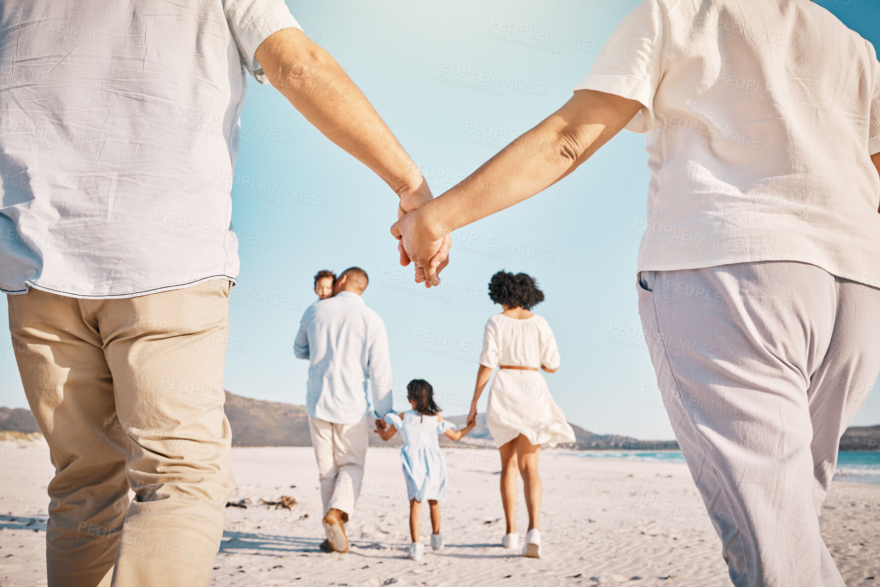 Buy stock photo Holding hands, beach family and people walk, bond or enjoy quality time together for vacation, holiday peace or freedom. Sea water, ocean love and back view of couple travel on Sydney Australia sand