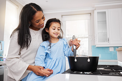 Buy stock photo Cooking, food and happy with mother and daughter in kitchen for learning, bonding and meal preparation. Smile, health and nutrition with woman and girl in family home for teaching, diet and culinary