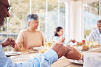 Praying, spiritual and family praise God before dinner or supper as gratitude together in dining room. Holding hands, religion and thankful `Christian people in hope, worship and prayer