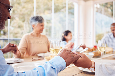 Buy stock photo Praying, spiritual and family praise God before dinner or supper as gratitude together in dining room. Holding hands, religion and thankful Christian people in hope, worship and prayer at a table