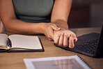 Carpal tunnel, pain and business woman at desk working with wrist massage, arthritis or muscle check. Worker or professional person hands closeup in medical injury from typing or writing on computer