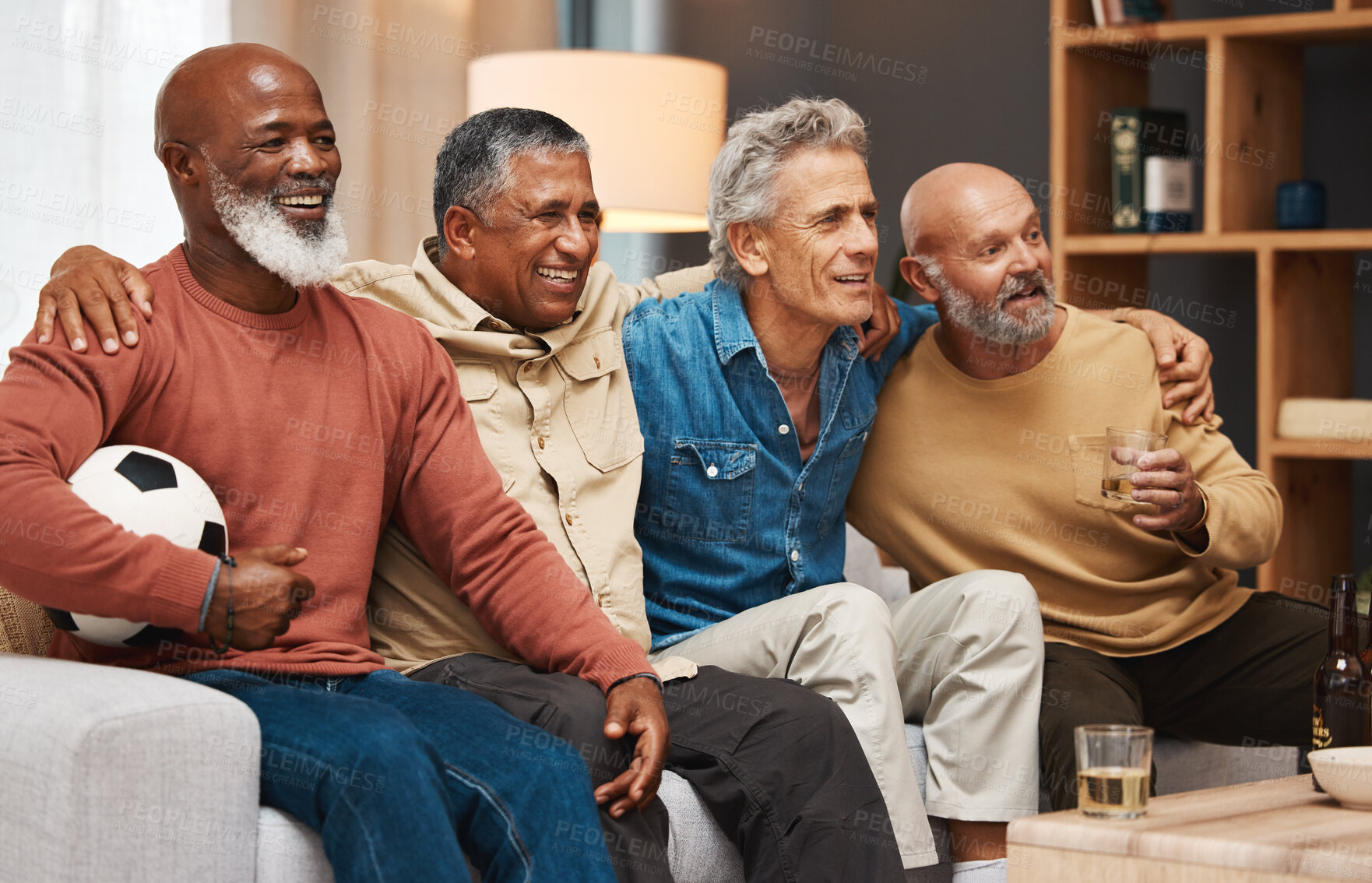 Buy stock photo Senior, friends and watching football on tv, relax or drinking beer, bonding or laughing. Comic, funny and happy elderly men streaming soccer on television having fun on sofa in living room in home