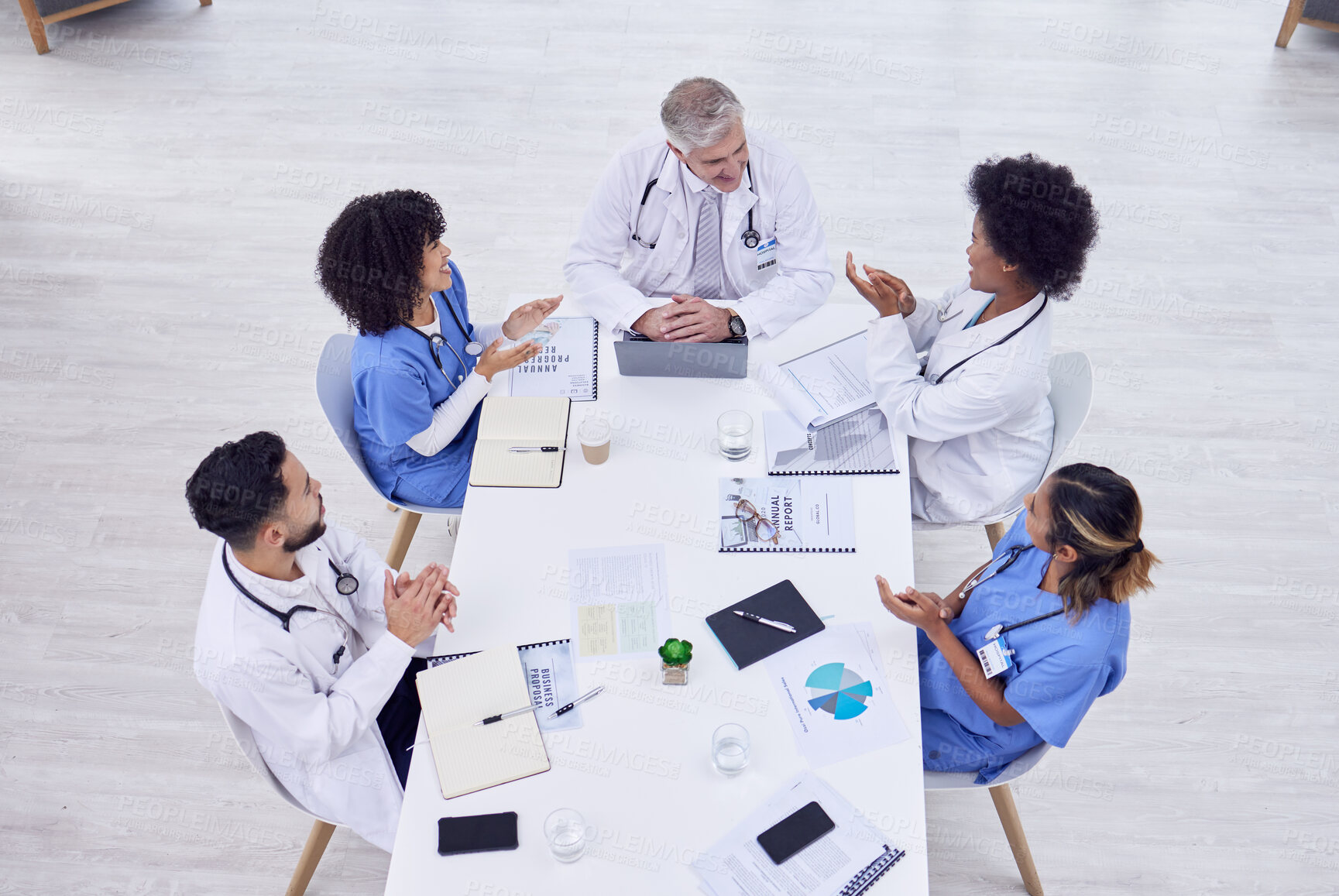 Buy stock photo Doctors, nurses or clapping in hospital meeting, teamwork training success or medical treatment innovation in top view. Smile, happy or applause of healthcare people in diversity collaboration goals