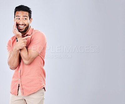 Buy stock photo Mockup, gossip and man with a secret in studio for whisper, drama or rumor against grey background. Asian, model and guy sharing, whispering and sneaky, telling and mysterious while advertising space