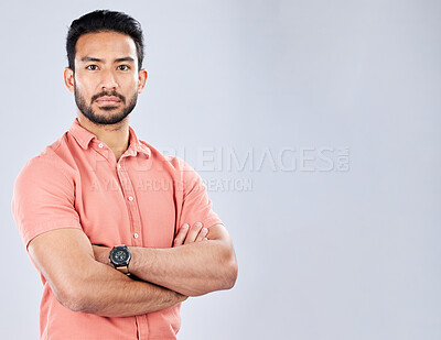 Buy stock photo Portrait, arms crossed and business man in studio isolated on a gray background mockup. Boss, professional or serious male entrepreneur from Singapore with career pride, confidence or success mindset