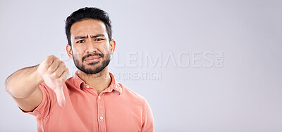 Buy stock photo Fail, thumbs down and portrait of Asian man in studio isolated on a gray background mockup. Dislike hand gesture, emoji and face of sad male model with sign for disagreement, rejection or bad review.