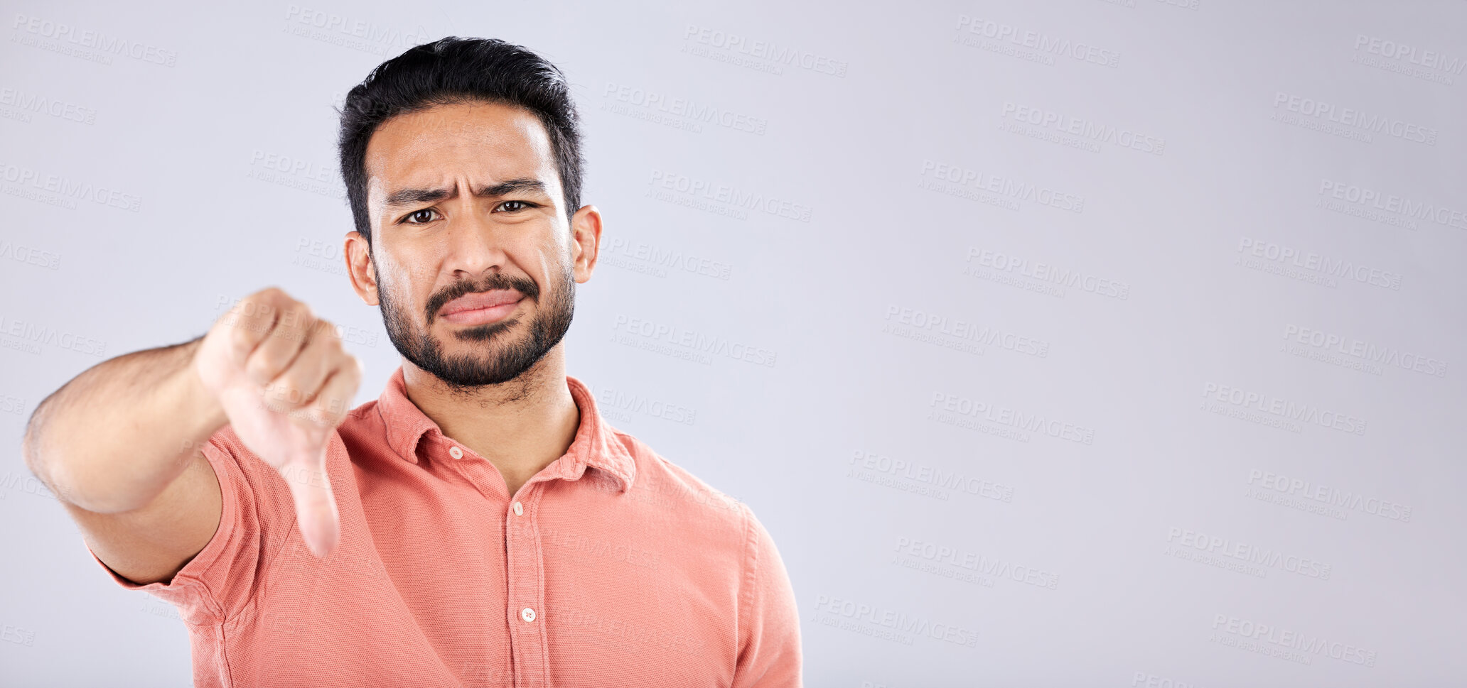 Buy stock photo Fail, thumbs down and portrait of Asian man in studio isolated on a gray background mockup. Dislike hand gesture, emoji and face of sad male model with sign for disagreement, rejection or bad review.