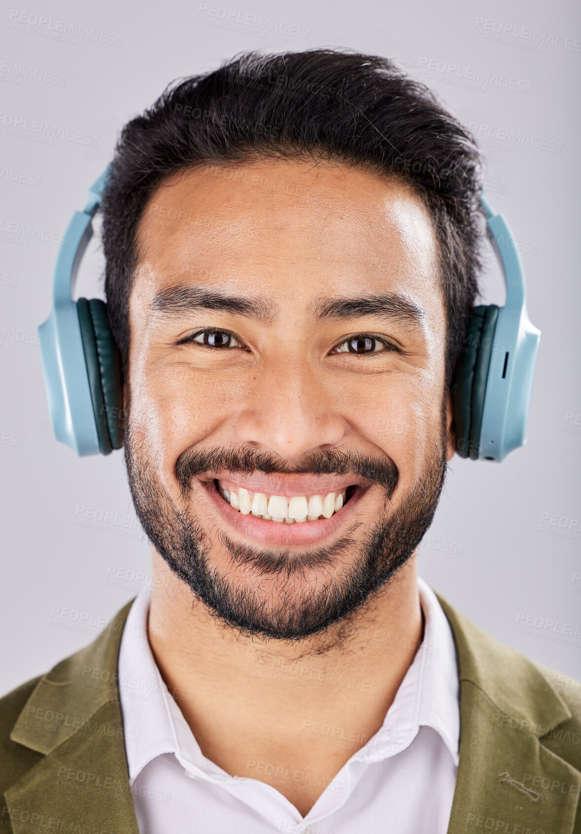 Buy stock photo Face, headphones and smile of business man in studio isolated on a gray background. Portrait, entrepreneur and happy Asian male streaming, listening or enjoying music, podcast or radio, song or album