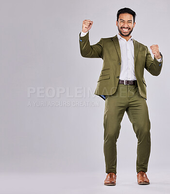 Buy stock photo Business man, portrait and happy about win, champion and success, cheers on studio background. Yes, fist pump and mockup space with young male, professional achievement and promotion, bonus or reward