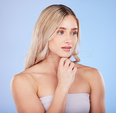 Buy stock photo Hair care, beauty face and thinking woman in studio isolated on a blue background. Makeup cosmetics, skincare and young female model with salon treatment for hairstyle, blonde balayage and growth.