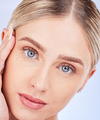 Buy stock photo Face portrait, skincare and beauty of woman in studio isolated on a blue background. Makeup cosmetics, aesthetic closeup and young female model with spa facial treatment for glowing and healthy skin.