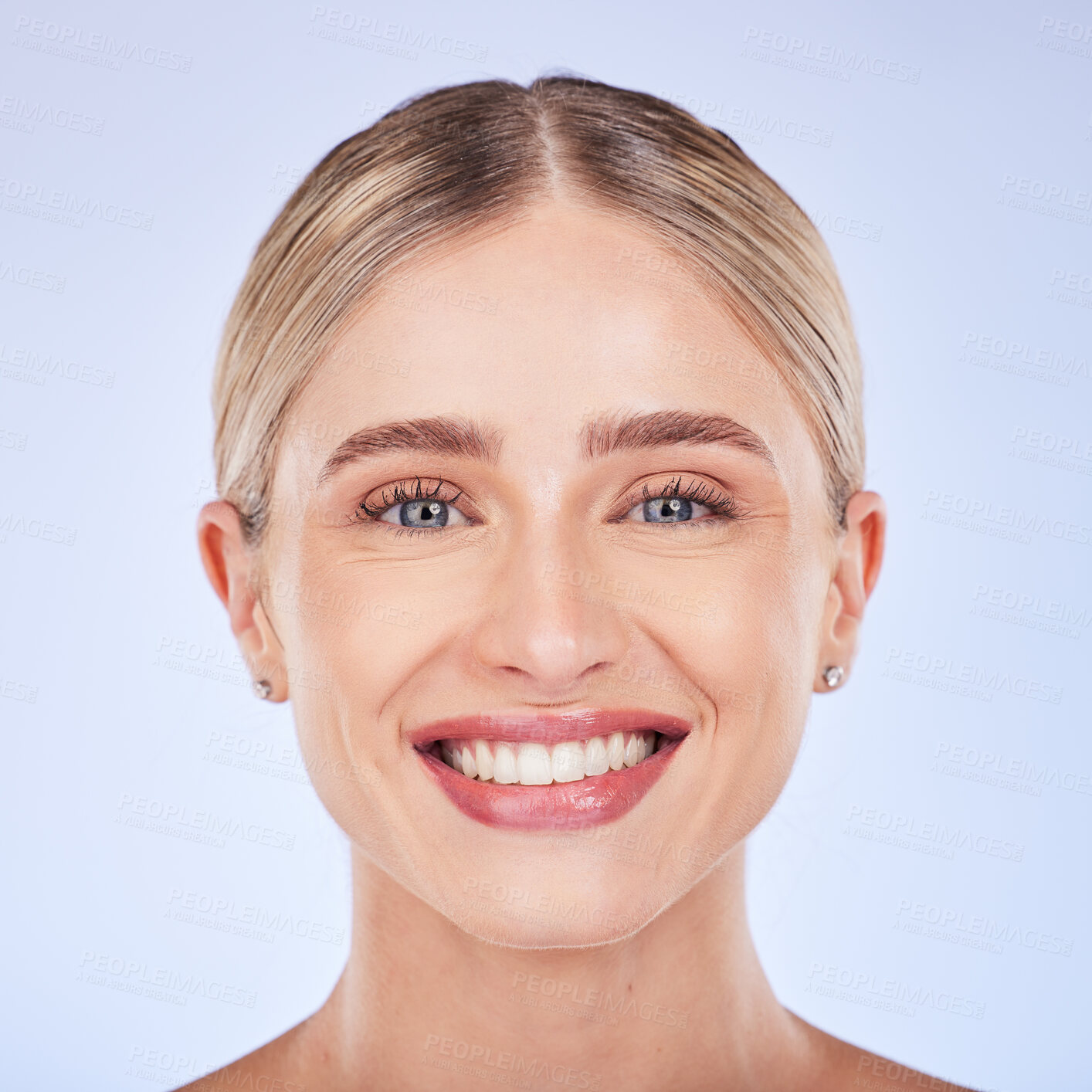 Buy stock photo Face portrait, smile and skincare of woman in studio isolated on a blue background. Makeup cosmetics, closeup and beauty of happy female model with spa facial treatment for glowing and healthy skin.