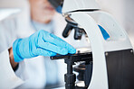 Hands, medical science and microscope in a laboratory for research, analysis and study. Scientist person in lab for futuristic development, innovation and biotechnology with dna or bacteria particle