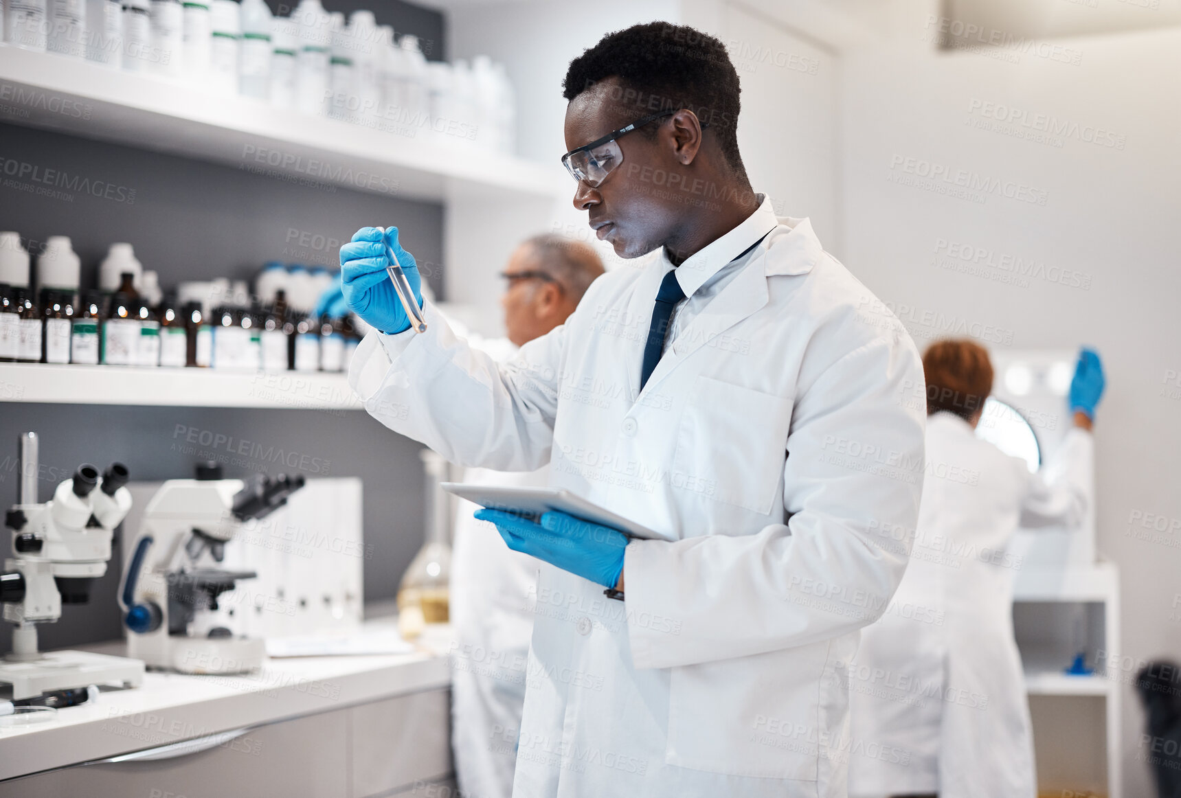 Buy stock photo Science, research and black man test tube and tablet for medical analysis and innovation in laboratory. Pharmaceutical analytics, medicine study and scientist in South Africa checking vaccine results